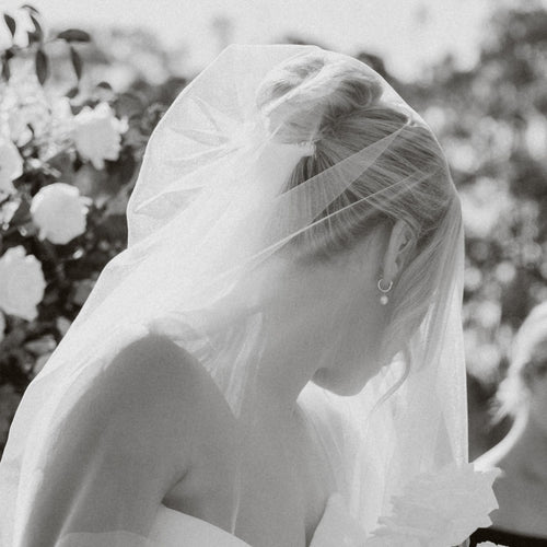 Bride wearing Pearl Hoop Earrings in Silver