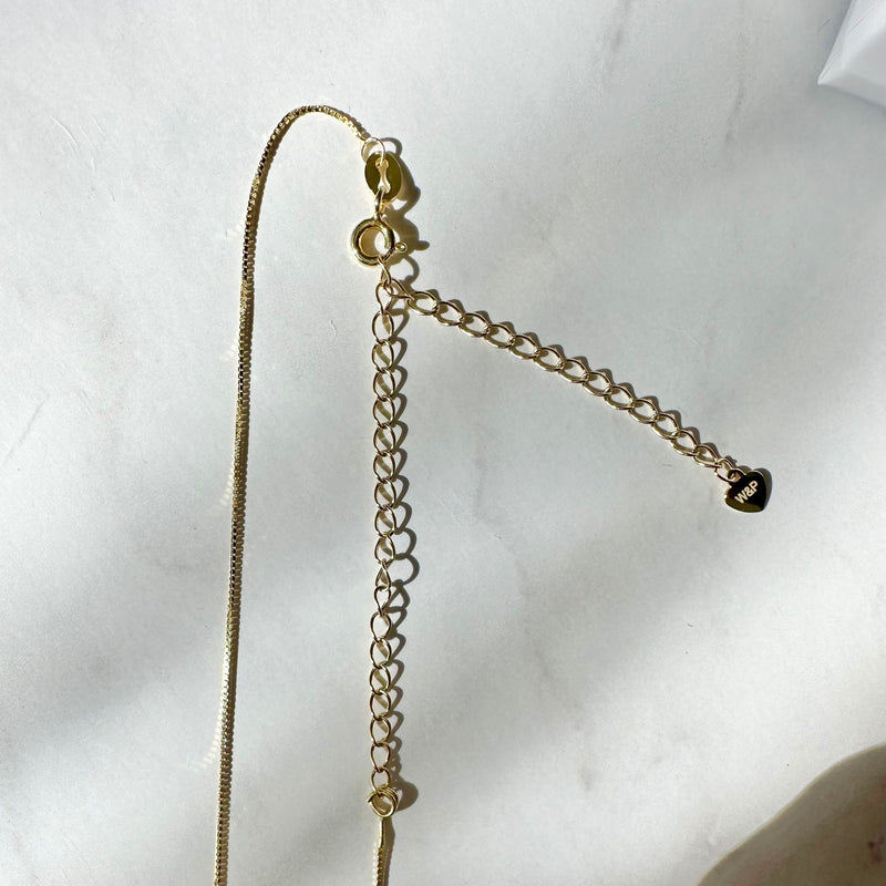 single pearl choker necklace on gold chain