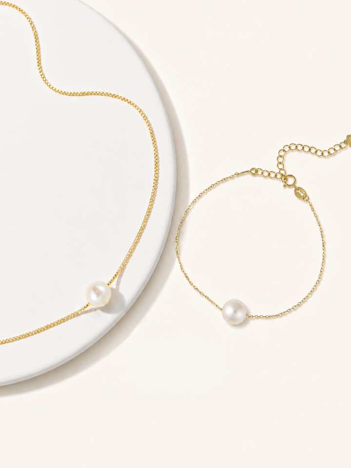 Pearl necklace and bracelet set in gold chain