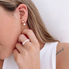 Pia pearl drop dangle earrings close up on model