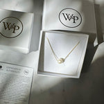 single pearl choker necklace on gold chain