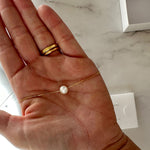 single pearl choker necklace on gold chain