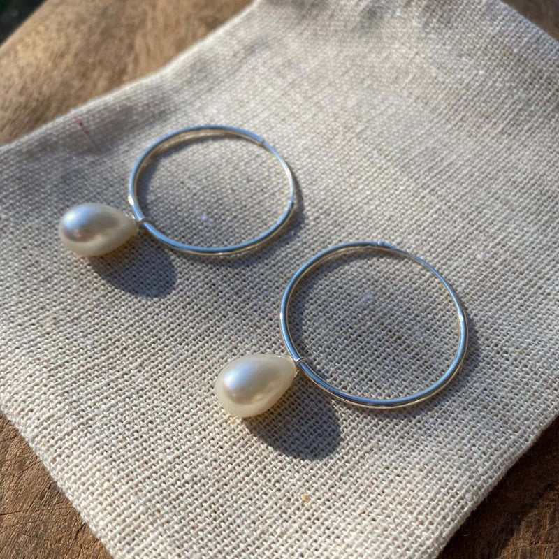 Image of the Silver Earrings laid out