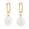 Large Keshi Pearls hanging from a gold vermeil hoop with a white background