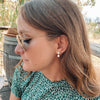 Pia earrings on model