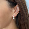 Pia earrings close up on model