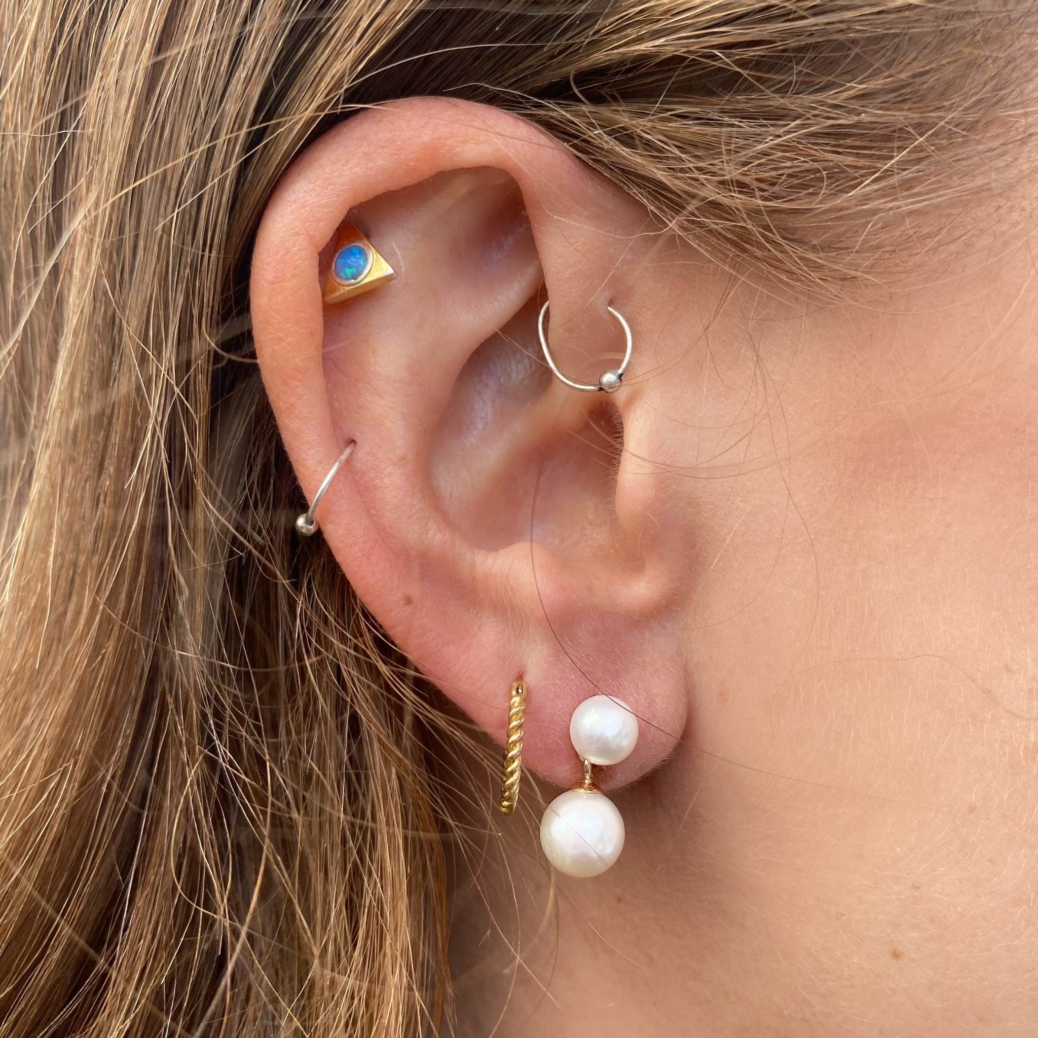 Pia earring close up with other earrings